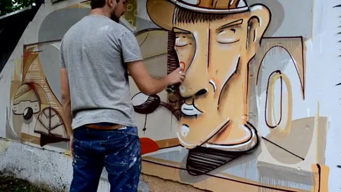 艺术家画涂鸦，用烟斗的人的照片。