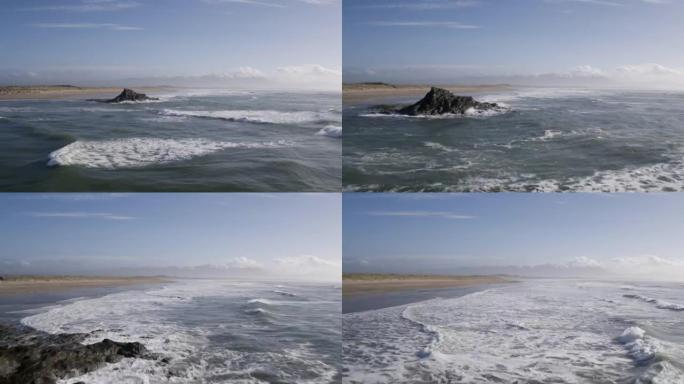 空中无人机拍摄的海浪在岩石上冲向天空