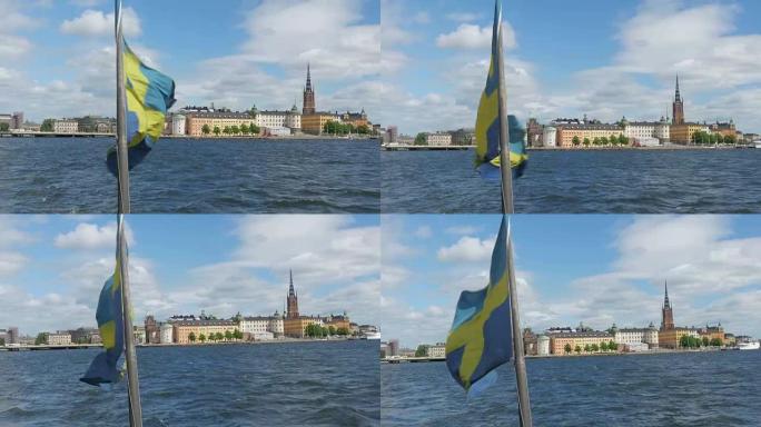 瑞典斯德哥尔摩日落时悬挂瑞典国旗的船