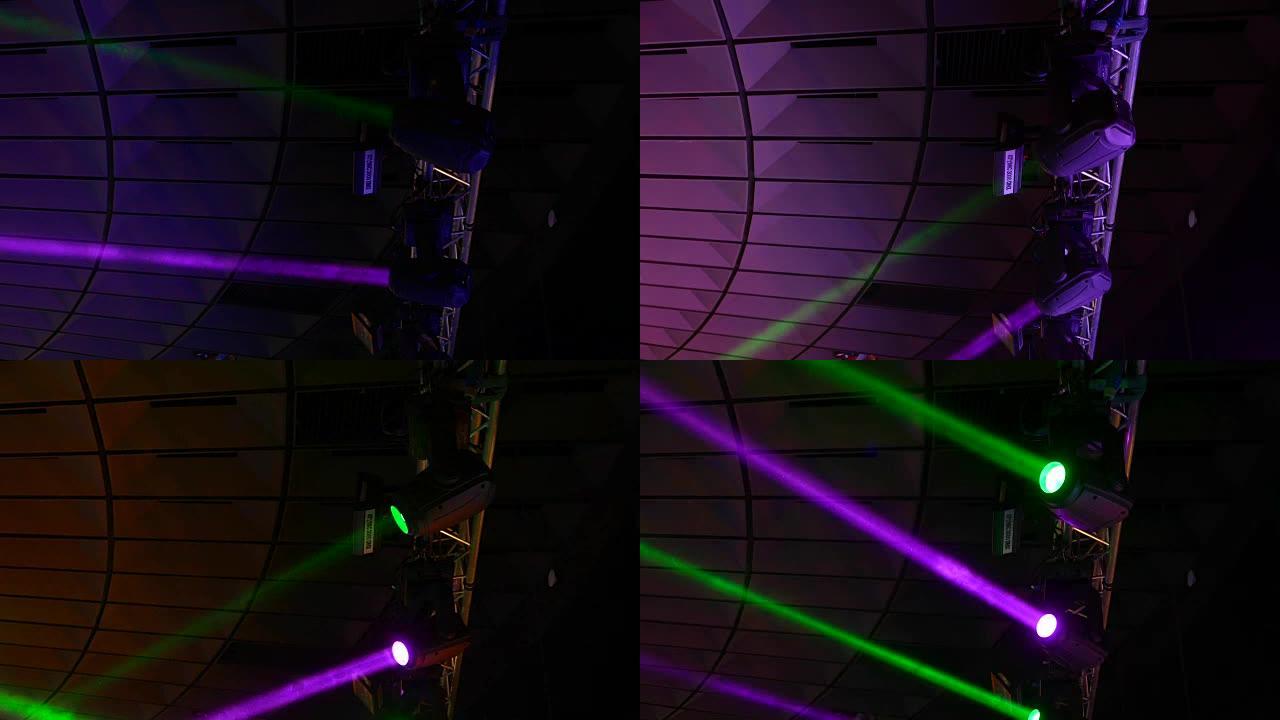 移动的头部，智能舞台照明在绿色和洋红色的光束中闪耀