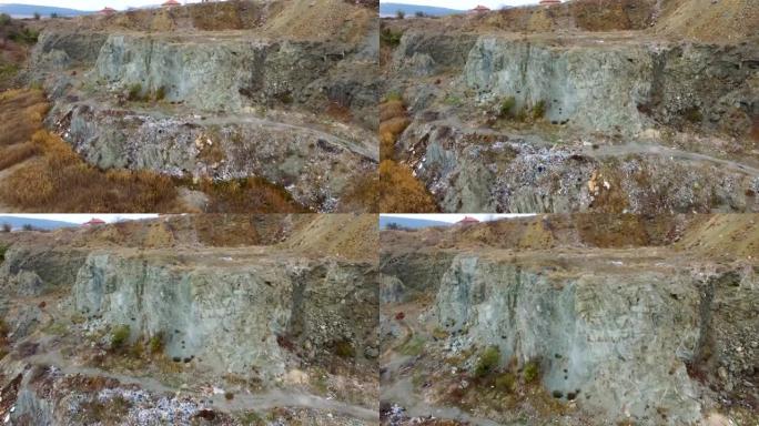空中: 废弃的采石场，堆放着碎屑