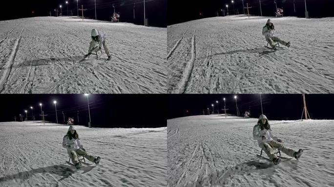 儿童在雪中滑雪和玩耍，在冬季雪中晚上雪橇时发生事故。UHD steadycam股票视频