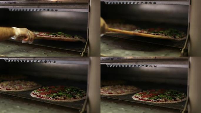 披萨进入市区披萨店的烤箱-慢动作