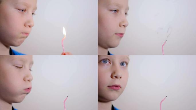 可爱的八岁男孩在室内吹蜡烛。慢动作
