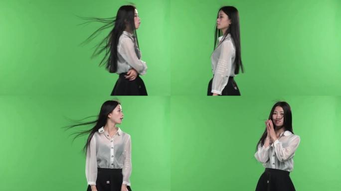 年轻漂亮的女孩再次关闭绿色屏幕