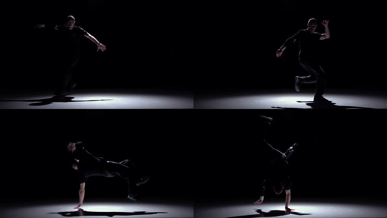 现代霹雳舞男子跳着手跳舞，黑色，阴影，慢动作