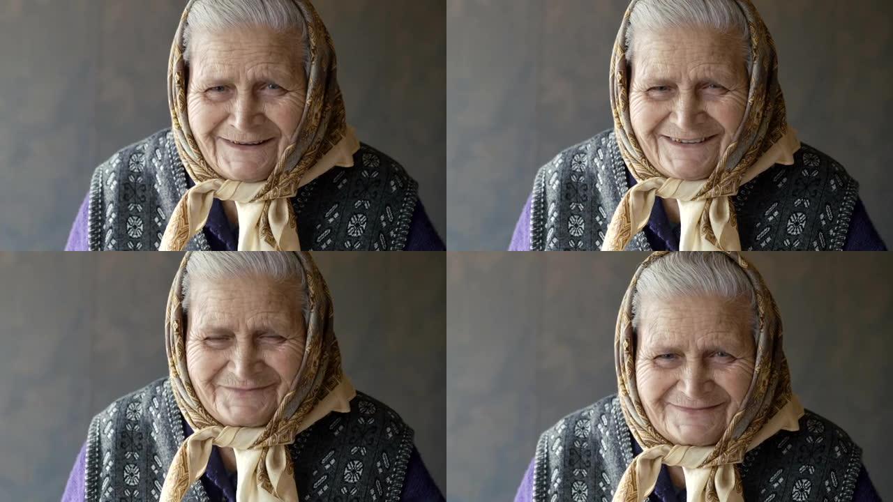 老皱巴巴的女人在镜头前微笑的肖像