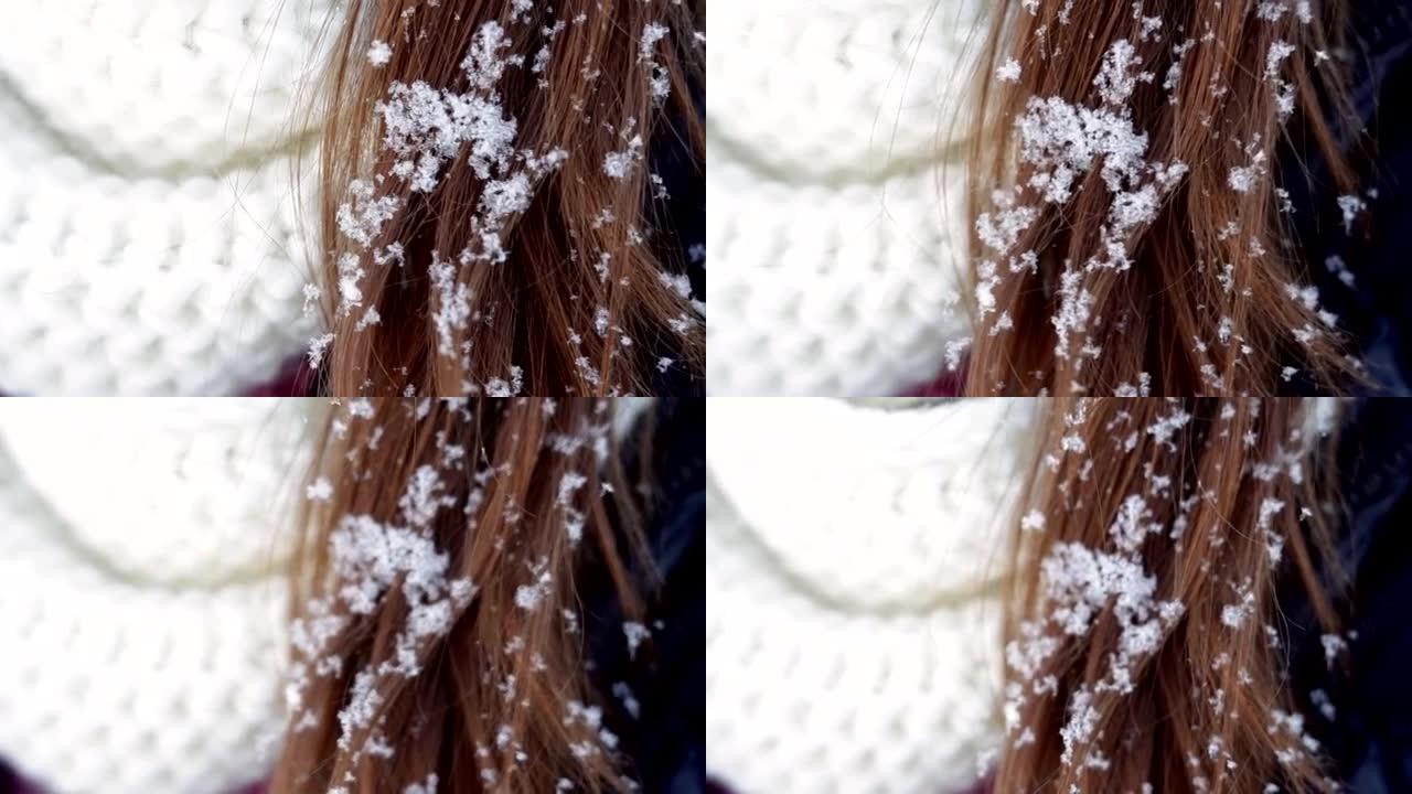 年轻女子戴着白帽子，围巾和头发上的雪