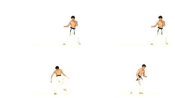 空手道或跆拳道男子跳跃，高踢腿和拳头打在白色