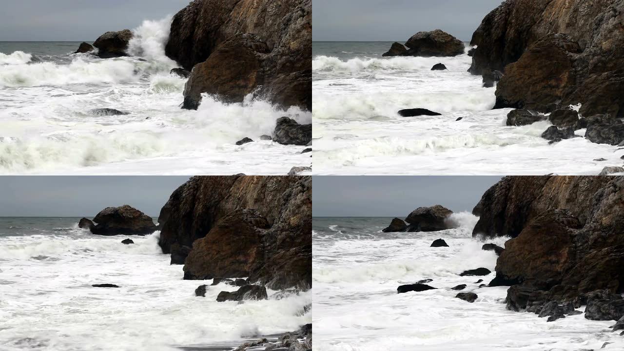 紧凑的中等波浪冲入岩石的岬角