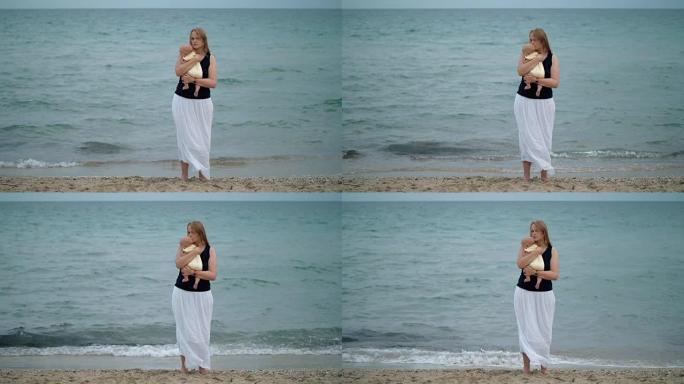 母亲拥抱婴儿，在海边的场景