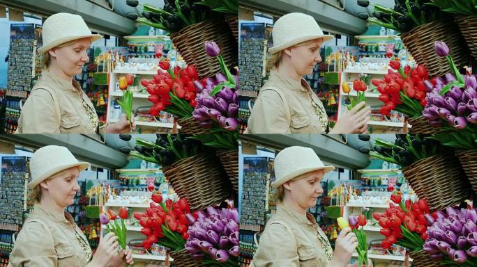 一个女人在阿姆斯特丹著名的花市选择郁金香