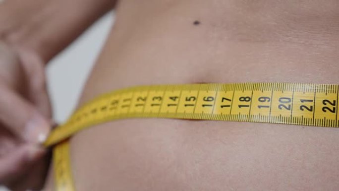 测量小腹尺寸保健和健身背景