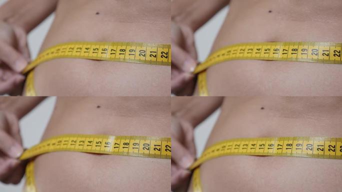 测量小腹尺寸保健和健身背景