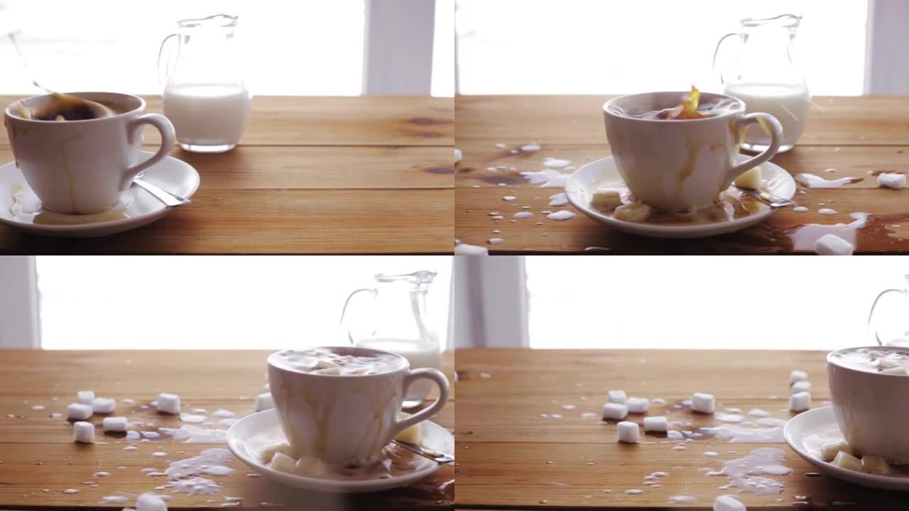 糖撒在木桌上的咖啡杯上
