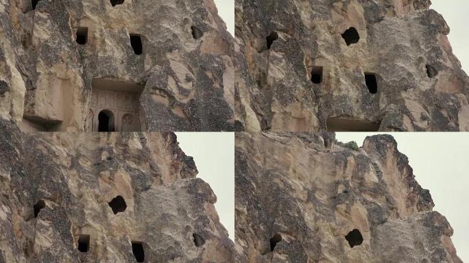 4k镜头。岩石中城市的门窗。手持摄像机