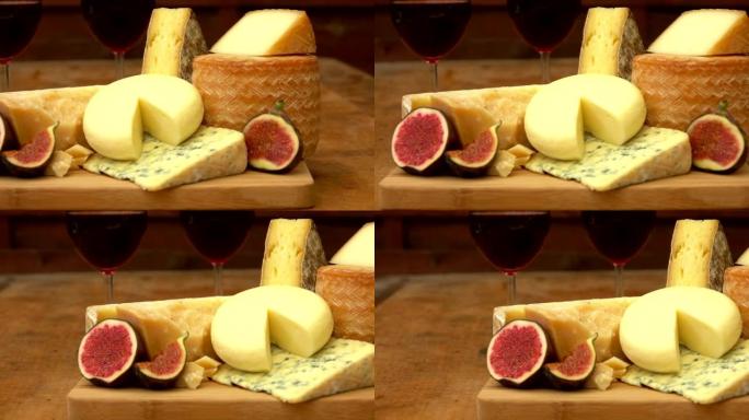 木桌上的奶酪，葡萄酒和无花果