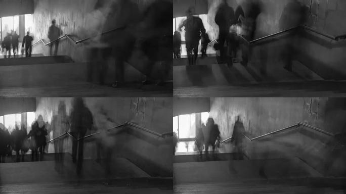 楼梯上行走的人的黑白照片的时间流逝。相机缩小
