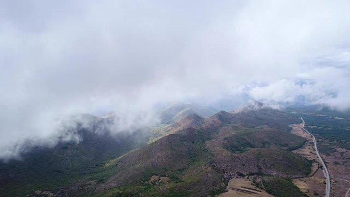 The clouds float above the mountains in the vicini