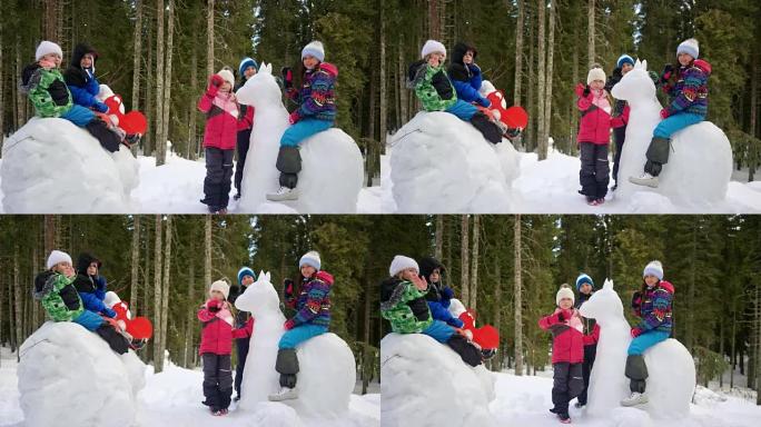 SLO MO儿童在白雪皑皑的森林操场上玩耍时挥舞的肖像