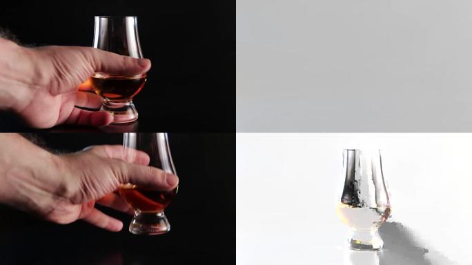 A hand picks up a glass alcohol drink and than put