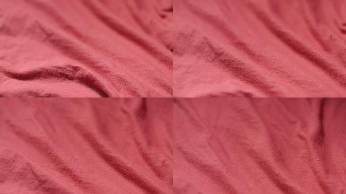 涤纶和棉红色纺织品的缓慢平移镜头