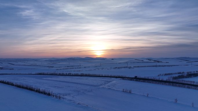 航拍4K东北垦区田野雪景落日