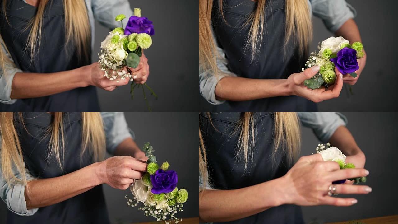 专业金发女花卉艺术家在花店布置美丽花束的慢镜头。花艺、手工制作和小型企业概念