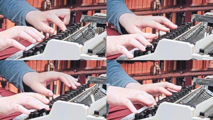 男孩坐在桌子旁打字