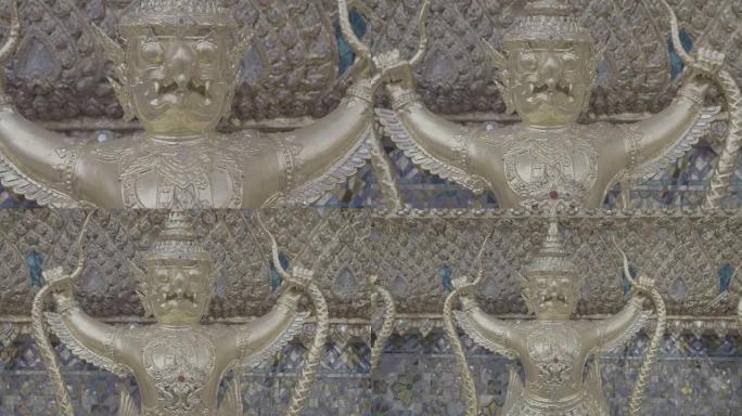 装饰金色人物环绕泰国曼谷瓦帕考寺的外部机器人; 慢动作
