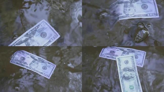 一百元钞票漂浮在河水下。关于意想不到的财富主题的概念