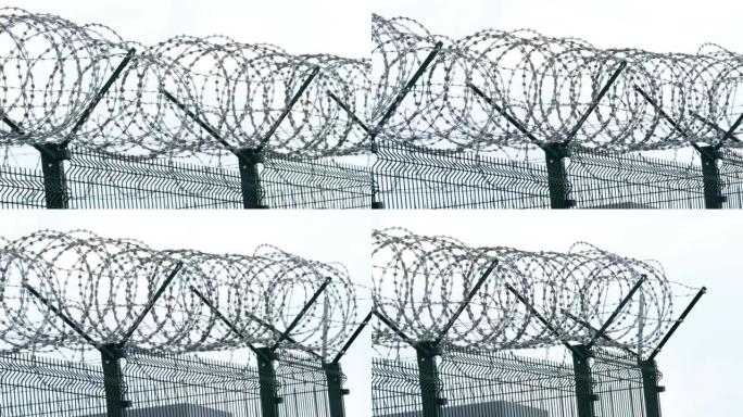 带铁丝网的安全栅栏。用铁丝网围栏。