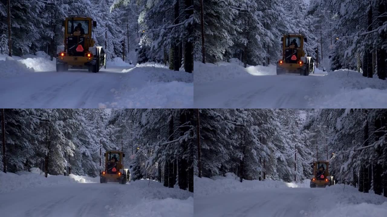 除雪。森林大雪后，拖拉机清除了道路