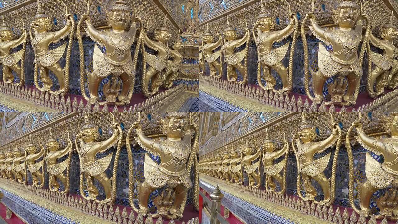 装饰金色人物环绕泰国曼谷Wat Phra Kaew寺的外部机器人