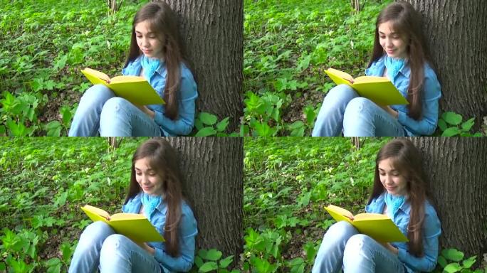 春天，可爱的少女看书翻页，靠在森林树干上，户外学习的肖像