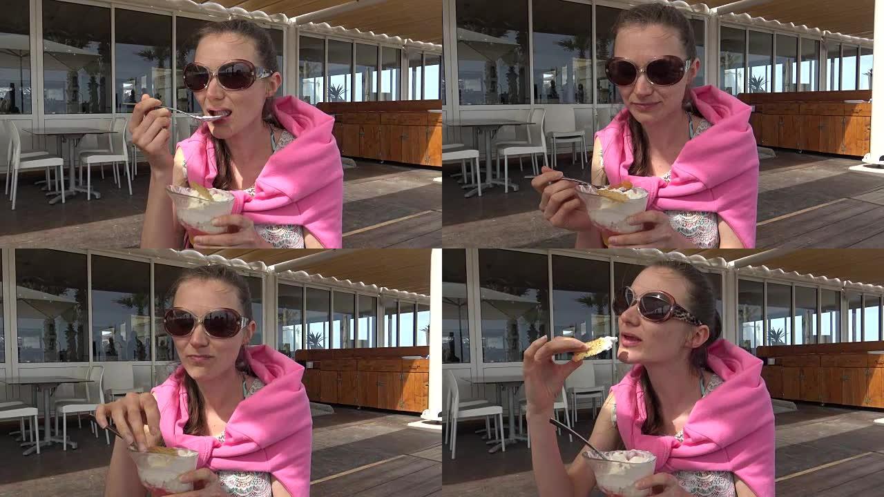 年轻女子在咖啡馆吃冰淇淋甜点