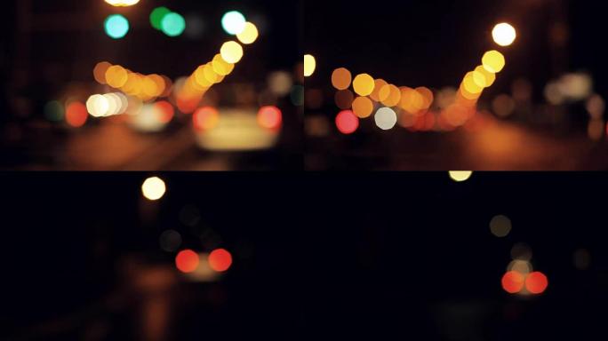 夜间行驶，模糊的汽车和城市灯光