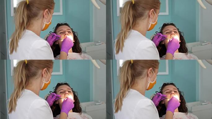 龋齿预防概述。牙科手术期间，牙医椅上的妇女
