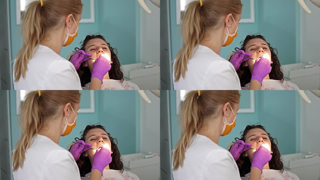 龋齿预防概述。牙科手术期间，牙医椅上的妇女