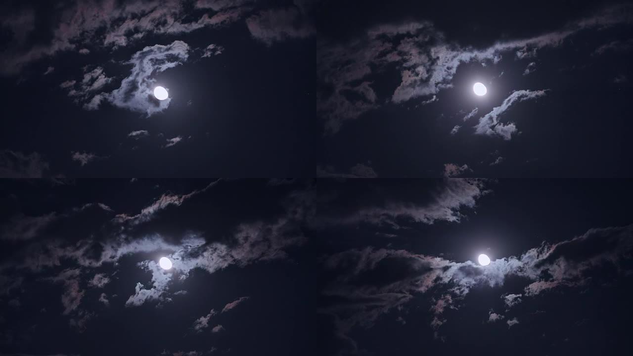 夜晚云层后面的半月