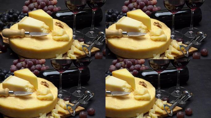帕尔马干酪或帕尔马干酪硬奶酪、葡萄和葡萄酒的整个圆头视频