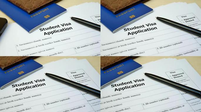 带护照和钢笔的学生签证申请表