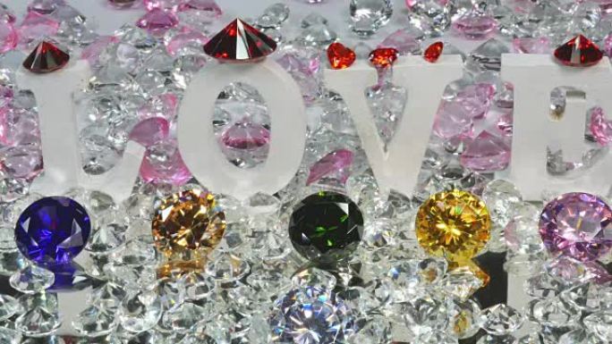 情人节用彩色钻石在白色背景下写的爱这个词用彩色钻石写的爱