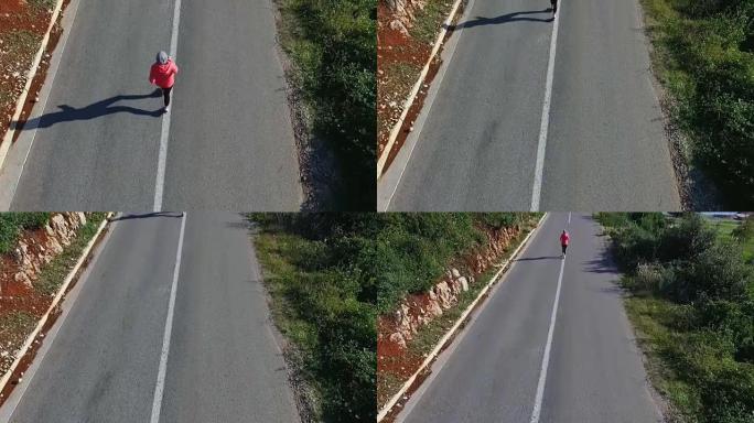 在开阔的乡村道路上跑步的健身女子的户外镜头