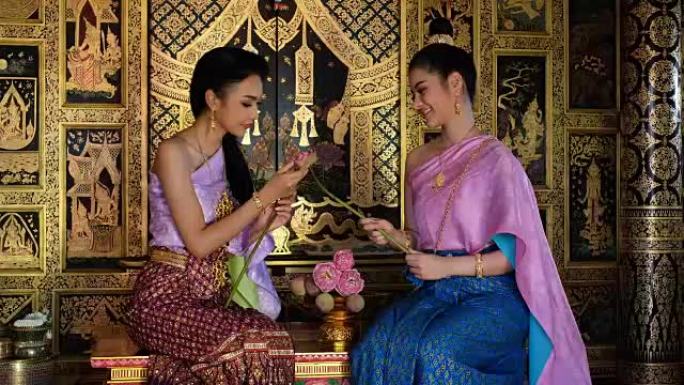 泰国年轻女子穿着泰国民族礼服套装荷花