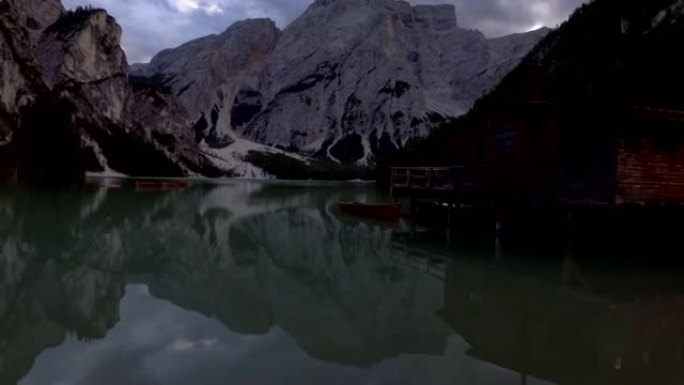 Tracking shot of stunning mountain lake at sunset 