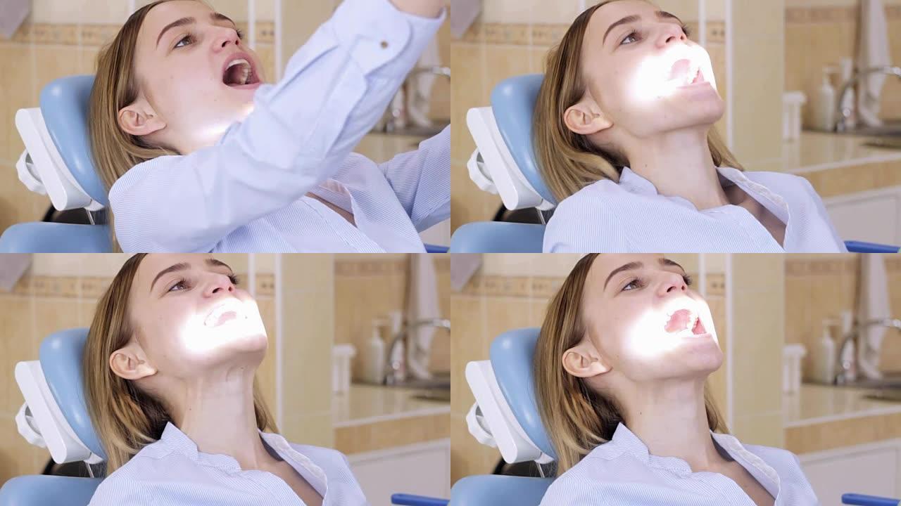 坐在牙医椅上的女孩自己调节光线