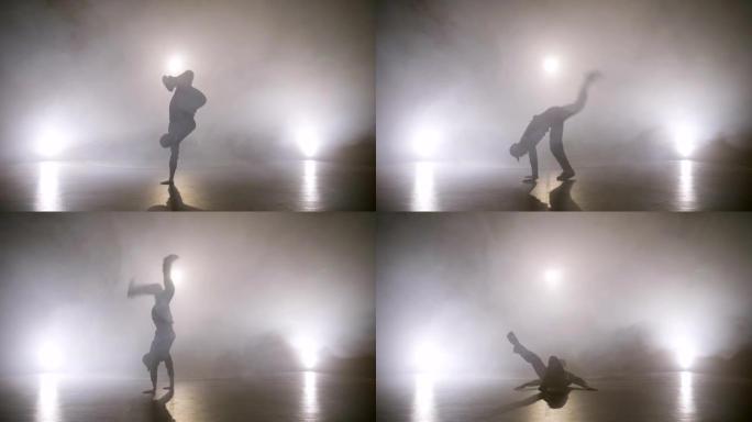 迷人的男孩在舞台上表演霹雳舞舞蹈技巧，同时试镜音乐视频剪辑