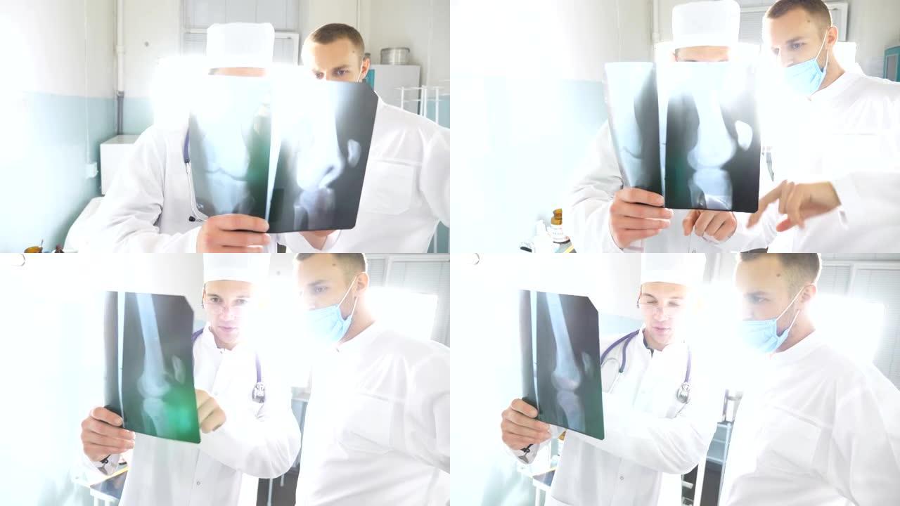 男性医生在看x光片的时候会互相商量。医院的医务人员检查x光照片。两位白种人医生观看核磁共振图像并讨论