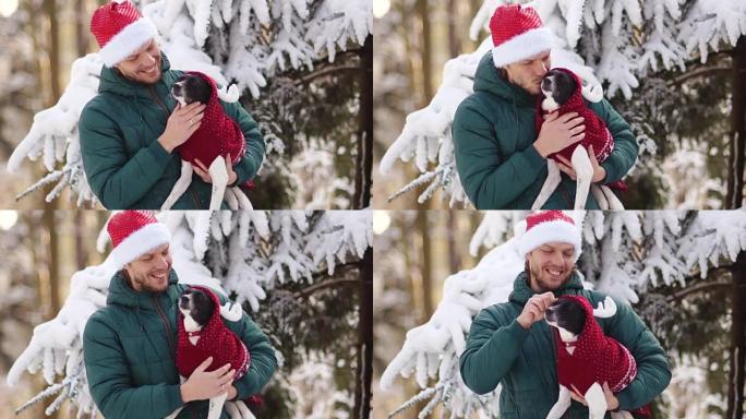 狗的新年，人与狗在冬天的森林。圣诞快乐男人吻小狗。圣诞老人的大胡子。寒假，狗年。圣诞晚会